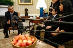 FILE - President Barack Obama meets with a group of "dreamers" who have received Deferred Action for Childhood Arrivals protection at the White House in Washington, Feb. 4, 2015.