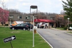 Ambulance crews are parked outside Andover Subacute and Rehabilitation Center in Andover, N.J., on Thursday April 16, 2020.
