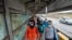 Migrants approach the U.S. border on Gateway International Bridge in Brownsville, Texas on March 2, 2021.