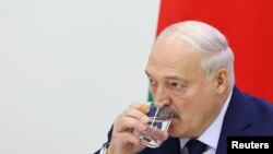 Belarusian President Alexander Lukashenko attends a press conference in Minsk