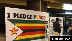 A "Peace Pledge" poster.