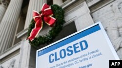A sign is displayed at the National Archives building that is closed because of a U.S. government shutdown in Washington, Dec. 22, 2018.