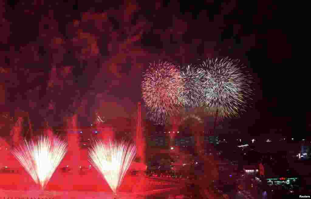 Fireworks explode around the Olympic Stadium to mark the start of the opening ceremony at the 2018 Winter Olympics in Pyeongchang, South Korea, Feb. 9, 2018. 