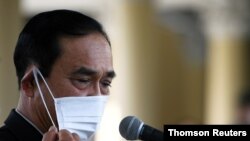 FILE - Thailand Prime Minister Prayuth Chan-ocha attends an agreement signing ceremony for purchase of AstraZeneca's potential COVID-19 vaccine at Government House, amid the spread of the coronavirus disease in Bangkok, Thailand, Nov. 27, 2