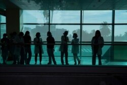 The medical staff listens during a news conference at Kaiser Permanente Los Angeles Medical Center in Los Angeles, Dec. 14, 2020.