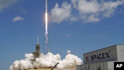 FILE - A Falcon 9 SpaceX rocket launches from Kennedy Space Center in Cape Canaveral, Fla., Aug. 14, 2017. 