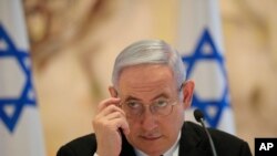Israeli Prime Minister Benjamin Netanyahu attends the first Cabinet meeting of the new government at Chagall Hall in the Knesset, the Israeli Parliament, in Jerusalem, Israel, May 24, 2020. 