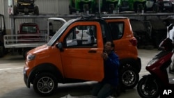 An employee works on a Quantum electric car at a factory in Cochabamba, Bolivia, May 9, 2023.