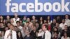 President Barack Obama, accompanied by Facebook CEO Mark Zuckerberg, speaks during a town hall meeting to discuss reducing the national debt at Facebook headquarters in Palo Alto, California, April 20, 2011.
