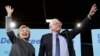Democratic presidential candidate Hillary Clinton and Sen. Bernie Sanders, I-Vt., take the stage during a campaign stop at the University Of New Hampshire in Durham, N.H., Wednesday, Sept. 28, 2016.