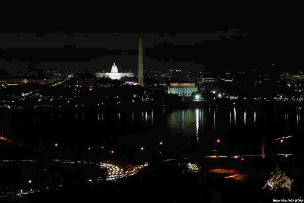 A view of the National Mall and monuments, as well as the U.S. Capitol, at night, Jan. 19, 2017.