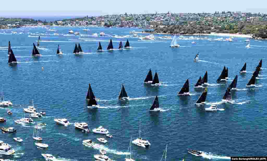 This handout image taken and received from Rolex shows yachts competing at the start of the annual Sydney to Hobart yacht race on Boxing Day on Sydney Harbor, Australia.