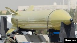 A military truck carrying a Shahab-3 missile drives by during a military parade commemorating the anniversary of the start of the 1980-1988 Iran-Iraq war, in Tehran, September 21, 2008. 
