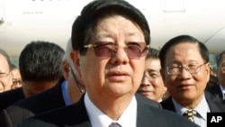 FILE - In this March 31, 2011, file photo, Cambodian Deputy Prime Minister Sok An walks at Phnom Penh International Airport in Phnom Penh, Cambodia. A government statement said Wednesday, March 15, 2017, that Sok An, who was one of Prime Minister Hun Sen's closest political and personal allies, has died at age 66. (AP Photo/Heng Sinith)