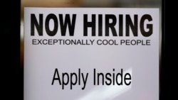 A 'NOW HIRING' is shown on the door of Padeli's Street Greek restaurant, Sept. 10, 2020, in Salt Lake City.