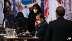 Elections headquarters staff work to register candidates for the June 18 presidential elections at the Interior Ministry in Tehran, Iran, May 11, 2021.