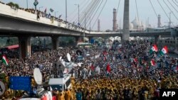 Activists and supporters of the Jamiat Ulema-e-Islam party gather during an anti-government "Azadi March" towards Islamabad, in Lahore, Oct. 30, 2019.