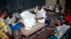 Electoral agents count the votes at a polling station on July 28, 2013 in the Malian capital Bamako. 