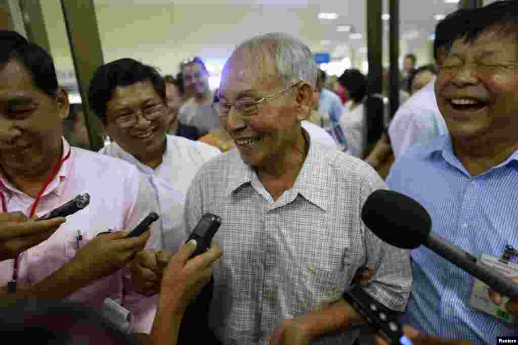 Brigadier General Thein Swe, who was sentenced to 152 years in prison following the 2004 ouster of an ex-intelligence chief, speaks to the media as he arrives at Yangon Airport, after being released from a prison, near Mandalay, Oct. 7, 2014. 