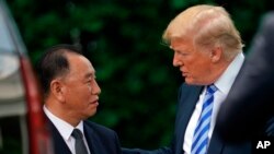 President Donald Trump talks with Kim Yong Chol, left, former North Korean military intelligence chief and one of leader Kim Jong Un's closest aides, after their meeting in the Oval Office of the White House in Washington, Friday, June 1, 2018. (AP Photo/Andrew Harnik)