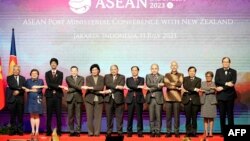 New Zealand's Foreign Minister Nanaia Mahuta (5th-L), Brunei’s Second Minister of Foreign Affair Erywan Yusof (6th-L) and Vietnam’s Foreign Minister Bui Thanh Son (7th-L) pose for a group photo with senior official leaders from (L-R) Amran Mohamed Zin of 