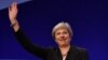 Britain's Prime Minister Theresa May waves after giving her keynote address on the fourth and final day of the Conservative Party Conference 2018 at the International Convention Centre in Birmingham, England, Oct. 3, 2018.