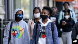 Students arrive for the first day of in-person classes at Erasmus High School in Brooklyn's Flatbush neighborhood, Thursday, Oct. 1, 2020 in New York. 