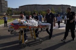An ethnic Armenian soldier, who was wounded in fighting with Azeri forces over the breakaway region of Nagorno-Karabakh, is moved on a stretcher to Erebouni Medical Center in Yerevan, Armenia, Sept. 29, 2020. (Credit: Hakob Margaryan/Photolure)
