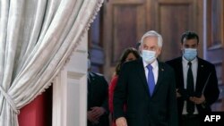 Photo released by the Chilean Presidency of Chilean President Sebastian Pinera arriving at La Moneda presidential palace, in Santiago, on October 12, 2021.