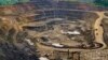 File - Excavators and drillers at work in an open pit at Tenke Fungurume, a copper and cobalt mine 110 kilometers northwest of Lubumbashi in Congo's copper-producing south, owned by miner Freeport McMoRan, Lundin Mining and state mining company Gecamines.