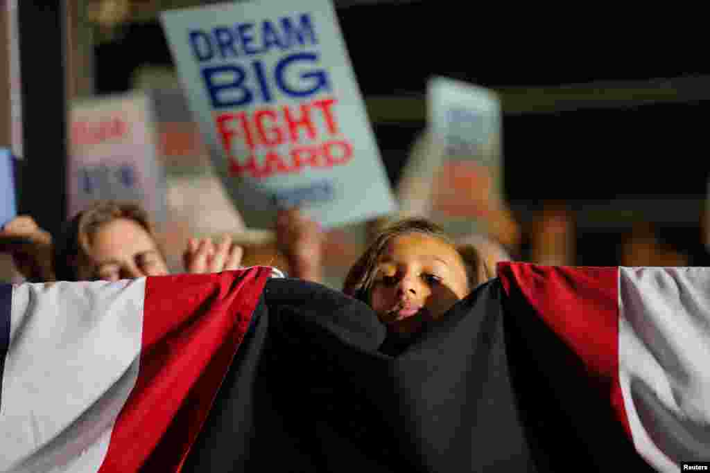 A young supporter watches as Democratic U.S. presidential candidate Senator Elizabeth Warren speaks at her Super Tuesday night rally in Detroit, Michigan, March 3, 2020.