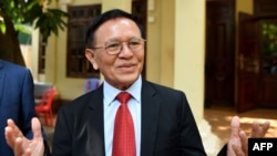 Kem Sokha, former leader of the now-banned Cambodia National Rescue Party (CNRP), speaks to media as he departs his residence for the Phnom Penh municipal court for his trial on January 15, 2020. 
