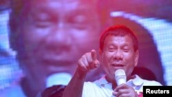 FILE - Philippine presidential candidate and Davao city mayor Rodrigo 'Digong' Duterte speaks during campaign rally in Manila May 1, 2016.