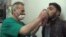 FILE - This video image from an anti-Bashar Assad activist group shows a Syrian man being treated with an inhaler in Kfar Zeita, north of Damascus, after what witnesses said was a chlorine gas attack, April 18, 2014.