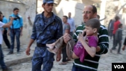 A child injured in a bombing in Syria is rushed to medical help.