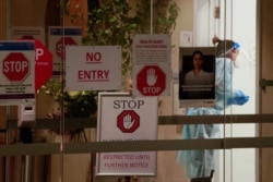 A staff member is seen inside the Epping Gardens Aged Care Facility amid the second wave of the coronavirus disease (COVID-19) in Melbourne, Australia, Aug. 17, 2020.