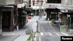 FILE - The normally bustling High Street in Auckland’s CBD is largely deserted during a lockdown to curb the spread of a COVID-19 outbreak, in Auckland, New Zealand, Aug. 26, 2021.