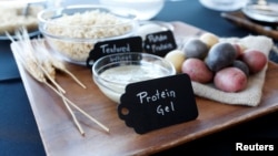 FILE - Ingredients for plant-based hamburgers, including a protein gel, are on display during a media tour of Impossible Foods labs and processing plant in Redwood City, California, U.S. October 6, 2016. (REUTERS/Beck Diefenbach)