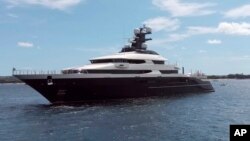A luxury yacht named "Equanimity" is seen in the Benoa harbor in Bali, Indonesia, Wednesday, Feb. 28, 2018. 