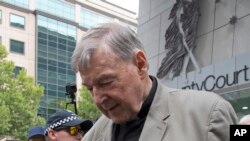 First responders salute as a U.S. flag is unfurled at the Pentagon in Washington, Sept. 11, 2022, at sunrise on the morning of the 21st anniversary of the 9/11 terrorist attacks.
