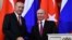 FILE - Russian President Vladimir Putin, right, shakes hands with Turkey's President Recep Tayyip Erdogan after their joint news conference following the talks in the Kremlin in Moscow, Russia, Jan. 23, 2019. 