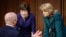 Homeland Security Secretary Alejandro Mayorkas, left, talks with Sen. Susan Collins, R-Maine, center, and Sen. Lisa Murkowski, R-Alaska, right, during a break of the Senate Appropriations committee hearing to examine domestic extremism, Wednesday,…