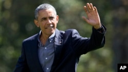 President Barack Obama waves as he walks on the South Lawn of the White House in Washington, Sept. 7, 2015.