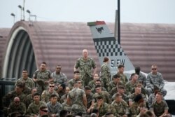 FILE - U.S. soldiers wait for a speech by U.S. President Donald Trump (not pictured) as he meets U.S. troops based in Osan Air Base, South Korea, June 30, 2019.