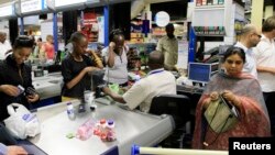 People shop at a Nakumatt store in an upmarket area of Nairobi, Kenya, Jan. 5, 2011.