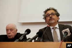 Ruben Mendoza, right, flanked by Monsignor Francis J. Weber, talks as part of a panel of California scholars discuss Spanish Franciscan friar Junipero Serra's life and legacy, in Rome, April 30, 2015.