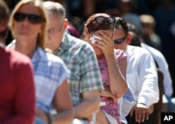 Attendees react at a prayer vigil for the victims of the shooting at Marjory Stoneman Douglas High School at the Parkland Baptist Church in Parkland, Fla., Feb. 15, 2018.