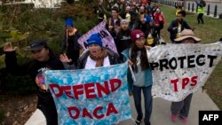 FILE - Demonstrators arrive in front of the US Supreme Court for Deferred Action for Childhood Arrivals (DACA), and Temporary Protected Status (TPS) on November 10, 2019 in Washington D.C. The DACA students are barred from getting emergency aid.