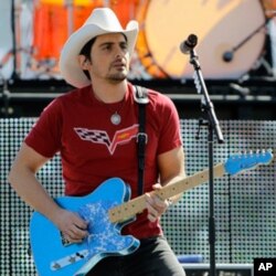 Country music singer Brad Paisley performs before the Daytona 500 NASCAR auto race at Daytona International Speedway in Daytona Beach, Fla., Sunday, Feb. 20, 2011. (AP Photo/John Raoux)