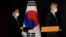US Special Representative for North Korea, Sung Kim and Noh Kyu-duk, South Korea's Special Representative for Korean Peninsula Peace and Security Affairs, arrive to attend a briefing after their meeting at a hotel in Seoul, South Korea Oct. 24, 2021.